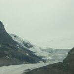 A view of the mountains from a car window.