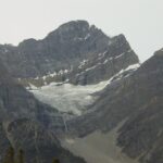 A mountain with snow on it's side.